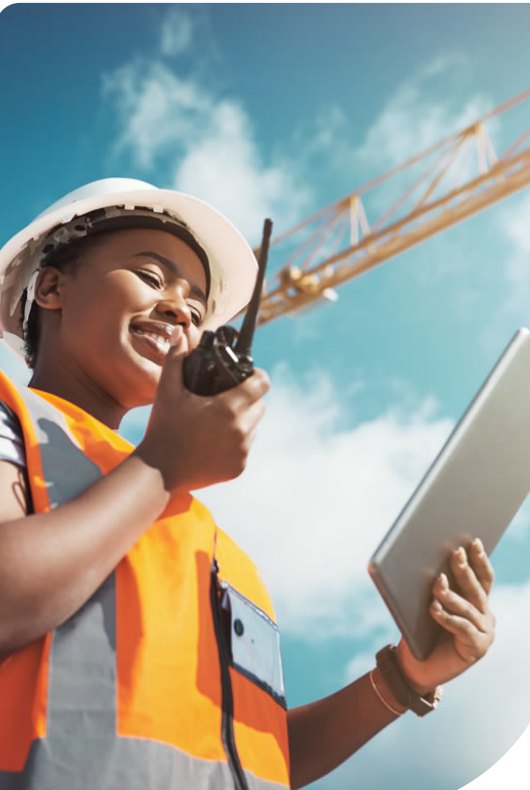 Professional telecom engineer holding a radio and tablet